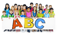 Children holding ABC sign